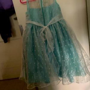 Have your little girl feel like princess Tiana in this green dress